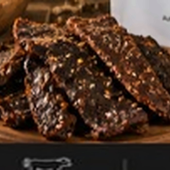 African Farm & Gardens Kilishi Strips served in a wooden bowl